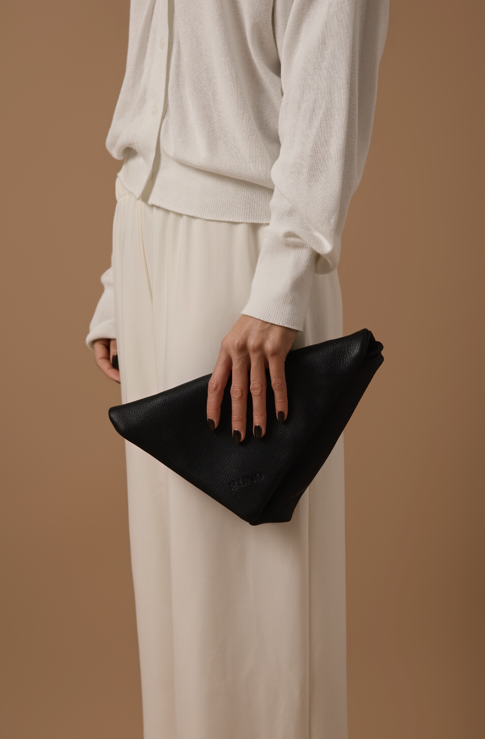THE NOMI CLUTCH