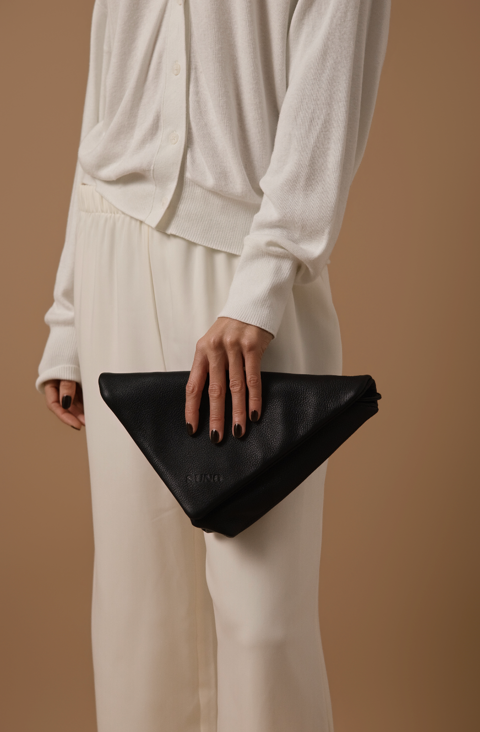 THE NOMI CLUTCH